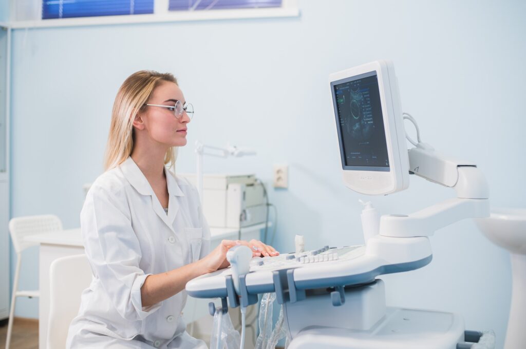 Smiling doctor, ultrasound. The doctor performed an ultrasound.