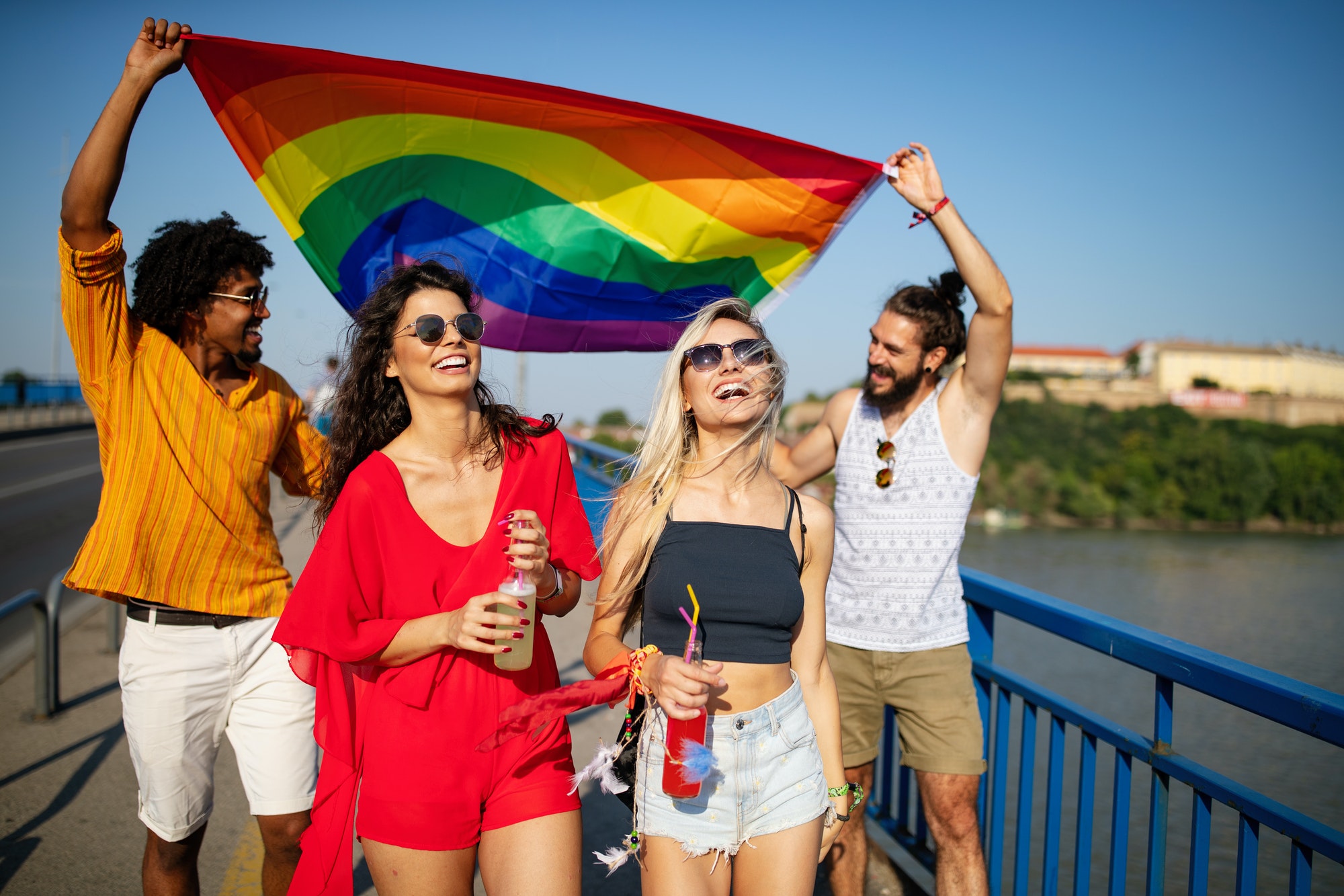 Group of friends, people attend a gay pride event