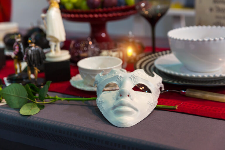 Christmas table decorated with mask and flower